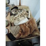 A box of vintage fur and other accessories including mink stole, gloves and more.