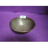 A brass bowl having extensive chase work to inner and outer body with Islamic or Egyptian design