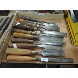 A selection of wood or cabinet makers flat spade and rounded turners or carvers chisels