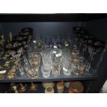 A mixed lot of vintage glasses including coloured cut glass and coloured glass with gilt