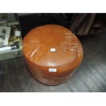 a vintage 60's styled leather foot stool or puffe