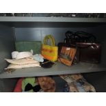 A collection of vintage handbags, handkerchief case and handkerchiefs,collars,compact and more.