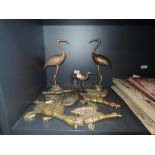 A collection of animal themed brass decorative items including three brass wall mounted flying