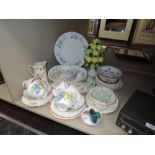 An assortment of ceramics including cups and saucers, platters,serving bowls and more.