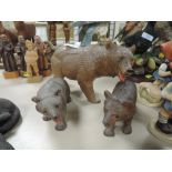 Three friendly looking carved wooden bears, in a black forest style, and similar wooden carved