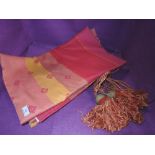 A set of Dorma curtains and tie backs in pinks and oranges.