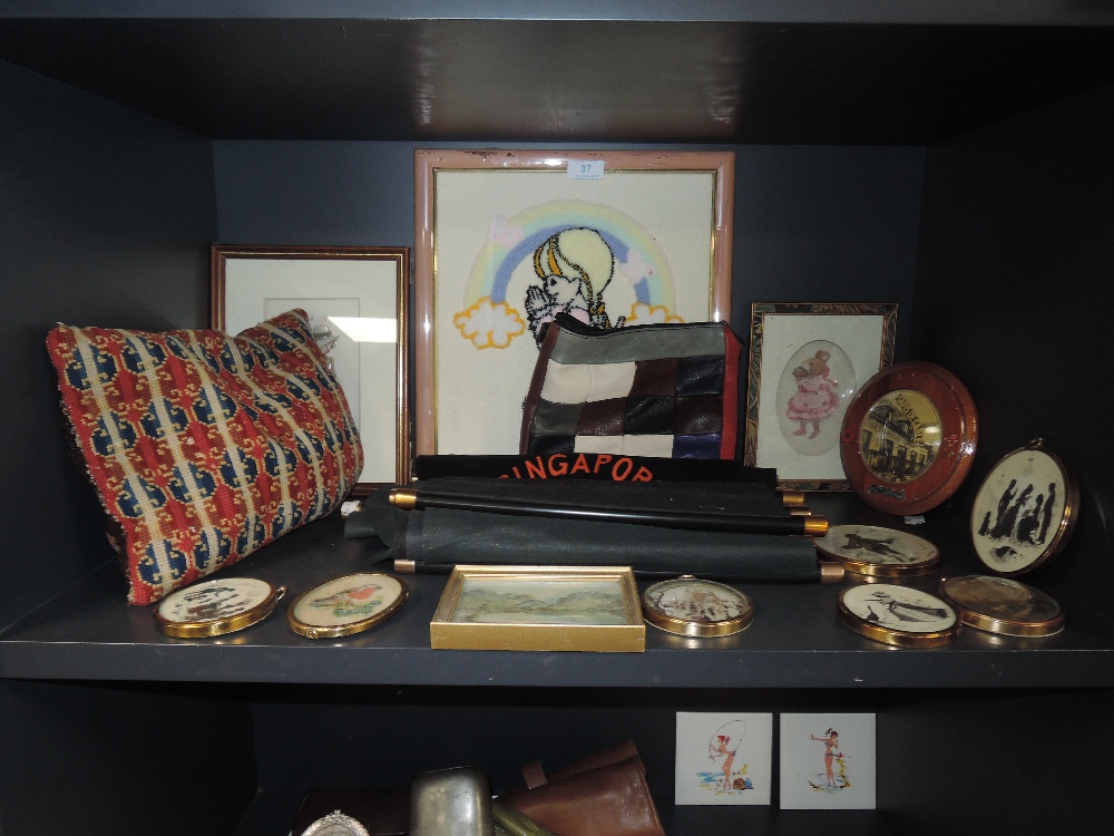 A mixed lot containing a selection of frames and miniatures,tourist collectables and more.