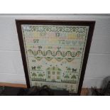 A framed cross stitch sampler worked by E Wier 1992, depicting animals,house,alphabet and more.