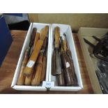 A selection of wood or cabinet makers various shape carving turning and bevel edge chisels