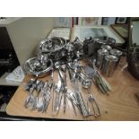 A large lot of kitchen utensils.