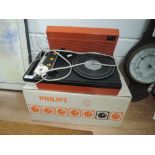 A vintage tangerine orange record player by Philips with box