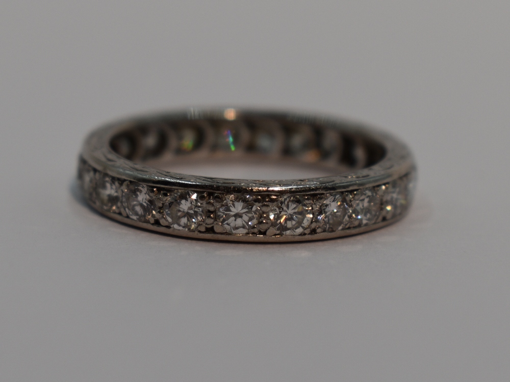 A lady's full eternity ring having 22 diamonds, total approx 1ct in a pave mount on a white metal