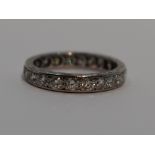 A lady's full eternity ring having 22 diamonds, total approx 1ct in a pave mount on a white metal