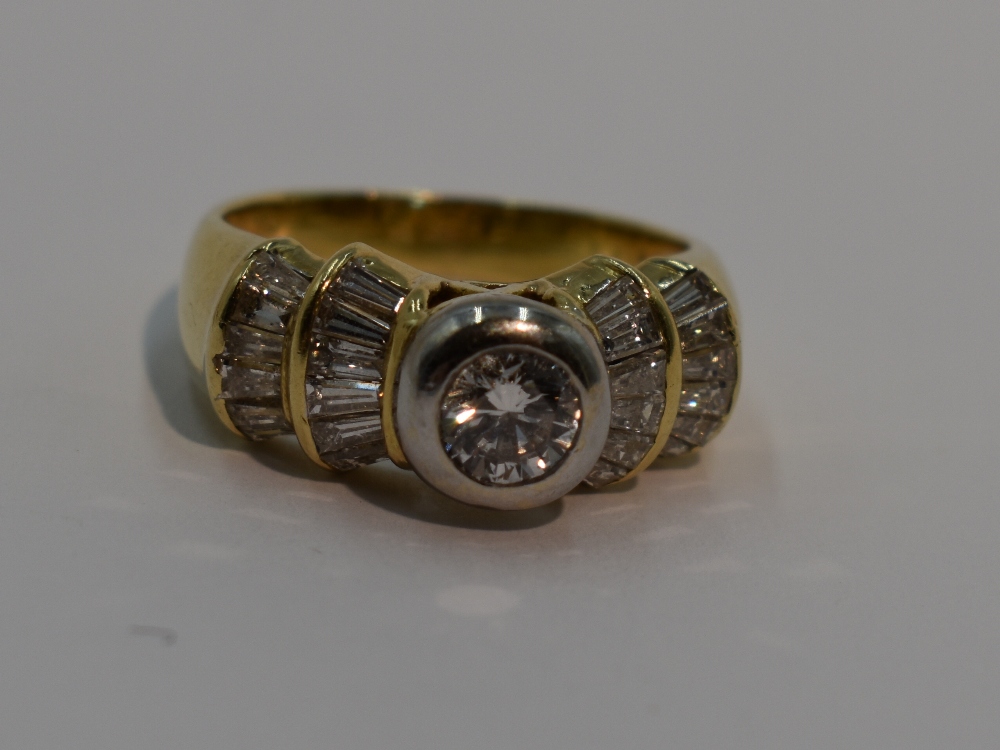 A lady's dress ring having a central diamond, approx 0.5ct to baguette diamond set stepped fanned - Image 2 of 2