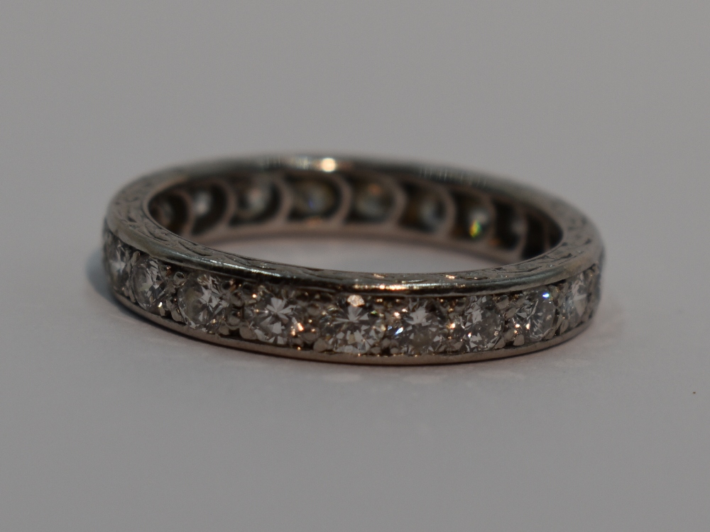 A lady's full eternity ring having 22 diamonds, total approx 1ct in a pave mount on a white metal - Image 2 of 2