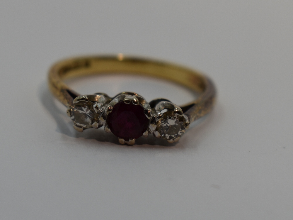 A lady's dress ring having a central ruby flanked by two diamonds, each stone approx 0.128ct in a - Image 2 of 2