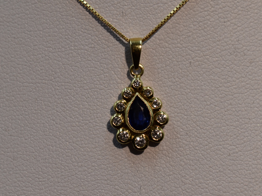 A sapphire and diamond teardrop cluster pendant in a yellow metal mount, marks worn, probably 18ct - Image 2 of 2