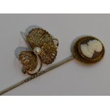 A 9ct gold brooch of stylised floral form having central cultured pearl, and a conch shell cameo pin