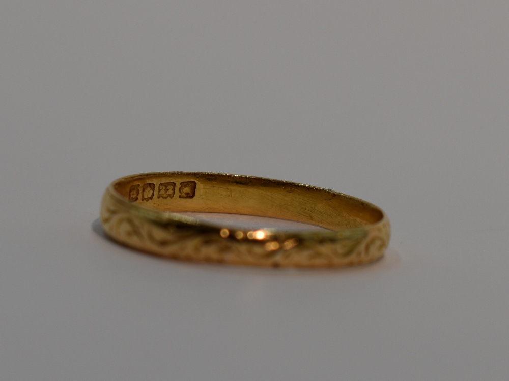 A 22ct gold wedding band having engraved scroll decoration, size V & 3.2g - Image 2 of 2