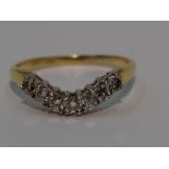 A lady's shaped half eternity ring having seven diamonds, total approx 0.35ct in a curved claw set