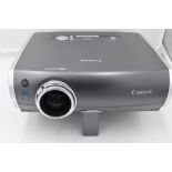 A Canon XEED SX50 multimedia projector with remote control in a Pelican 1600 hard case