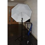 A selection of lighting equipment including a pair of Lastolite collapsable reflectors with tripod