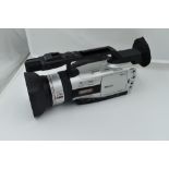 A Canon XM2 3CCD digital camcorder with Canon Fluorite 20 lens, and Canon Wide Converter WD-50,