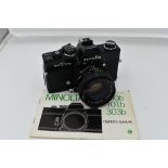 A Minolta SR T 101b camera with users manual