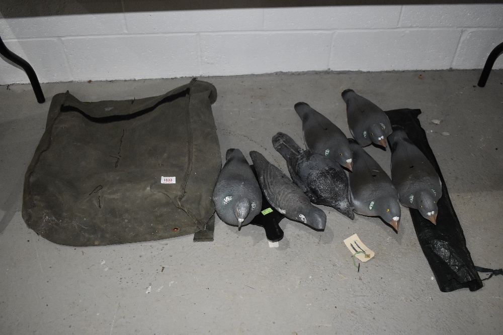 A canvas bag containing pigeon decoys.