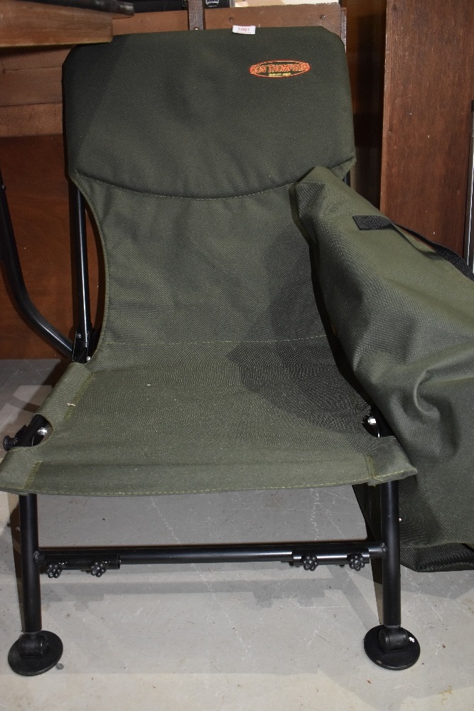 A Ron Thompson course fishing chair in unused with sideplate rod holders in bag.