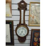 A vintage carved oak bodied barometer with enamel face dial glass AF