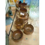 A selection of Denby tea cups and saucers in the Sandstone design