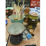 A selection of vintage kitchen wares including green glaze Hornsea pottery jar trivet and utensils