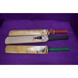 Three miniature cricket bats two bearing signatures one dated 1998 and similar