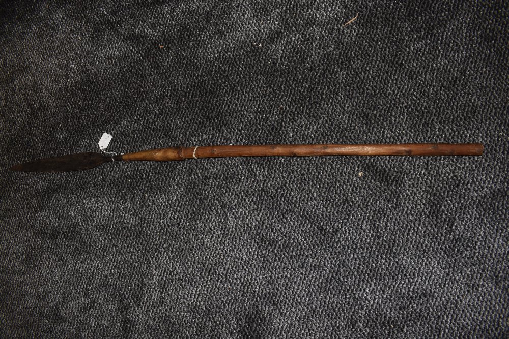 A small tribal spear having wood shaft with wrought iron tip measuring 104 cm long possibly from the