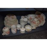 An extensive collection of vintage Denby including plates, tureens, mugs, cups and saucers and