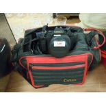 A Canon T80 camera with bag and flash.