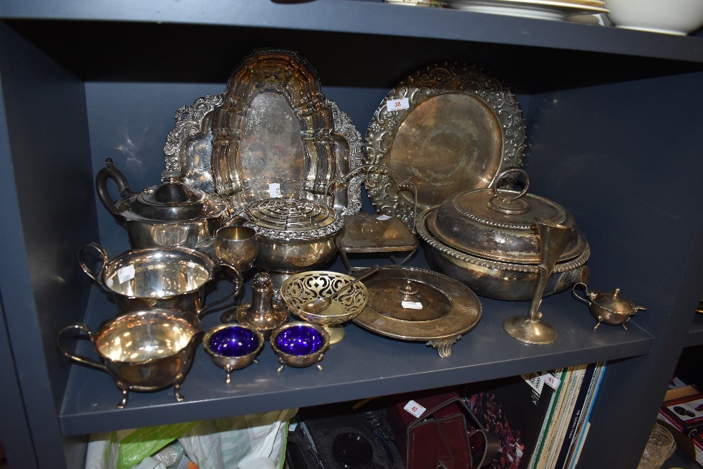 An assortment of plated wares and similar including vases, rose bowl, platters,cruet and more.