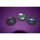 Three small cloisonné pin dishes having floral pattern on cobalt blue and teal green grounds.