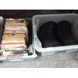 A box full of 45rpm singles,mixed interest including Dire straits, UB40 and more.
