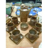 A retro Surrey ceramics partial coffee service, having paisley pattern, five cups with square