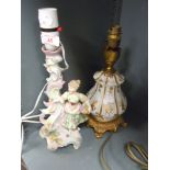 Two ceramic lamp bases including hard paste figural hand decorated and similar squat with gold