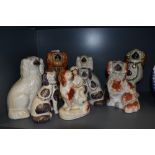 An assortment of Staffordshire mantel dogs two pairs and other singular A/F