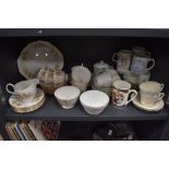 A mixture of ceramics including Colclough cups and saucers, commemorative mugs Stanley china and