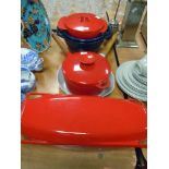 A selection of cast and enamel Creuset style cooking pans and dishes