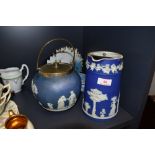 A Wedgwood biscuit barrel and a lidded jug, also included is a small trinket dish.