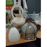 A selection of shabby chiq style decorations including glass shades, large glazed pot candle holders