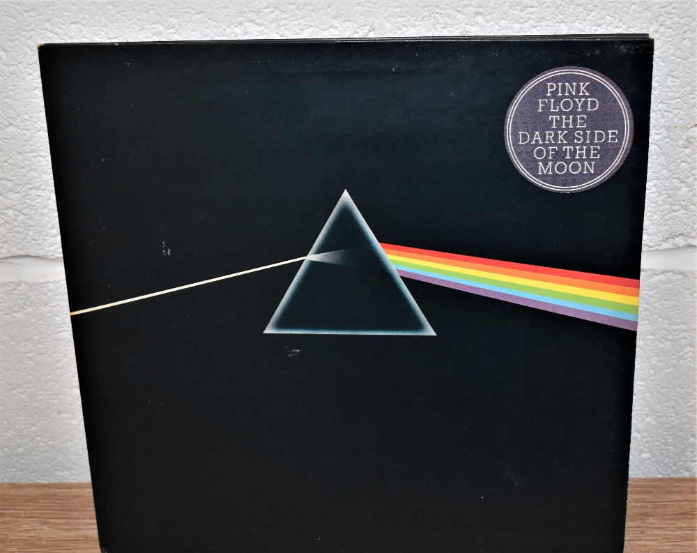 A very nice complete Pink Floyd Dark Side of the Moon with both posters and postcards