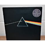 A very nice complete Pink Floyd Dark Side of the Moon with both posters and postcards