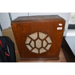 An early 20th Century oak speaker cabinet containing Celestion speaker